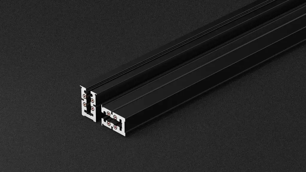 Black extruded aluminum in-wall track rail profile from the award-winning OZ Lighting System 77, engineered for flush architectural integration with no visible cables.